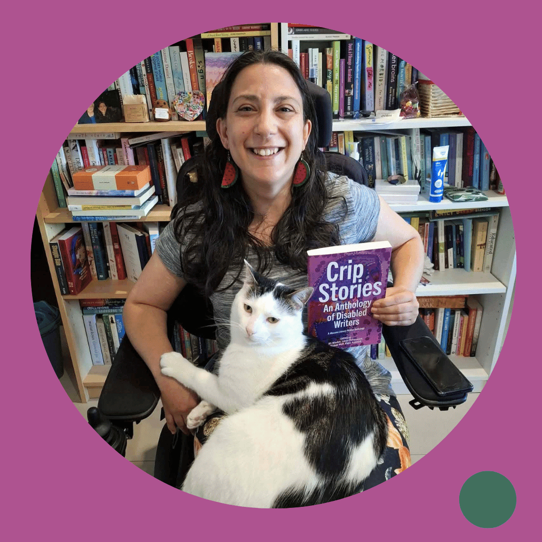 Lady holding a book next to her cat