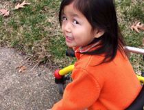 Young girl riding a bike